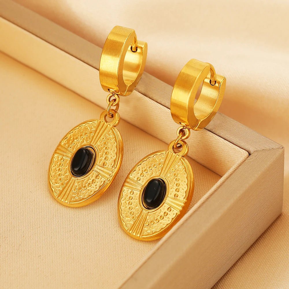 Gold huggie hoop earring hook clips with textured round charms and black accents