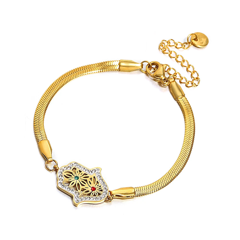 Gold-tone mesh bracelet with a crystal-edged hamsa charm and floral filigree