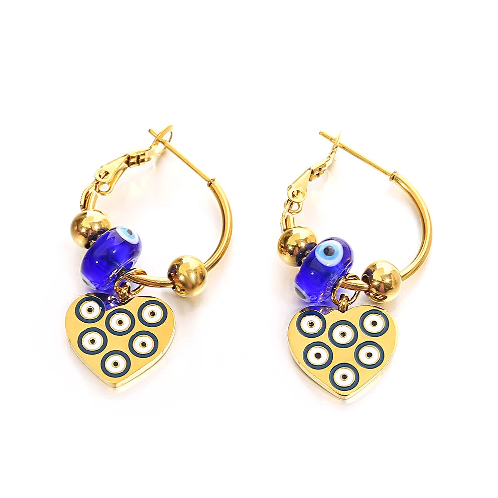 Gold-tone hoop earrings with blue beads and multi-eye heart charms