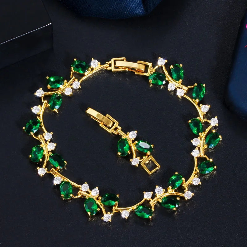 Gold-tone leaf branch bracelet with green and clear cubic zirconia stones
