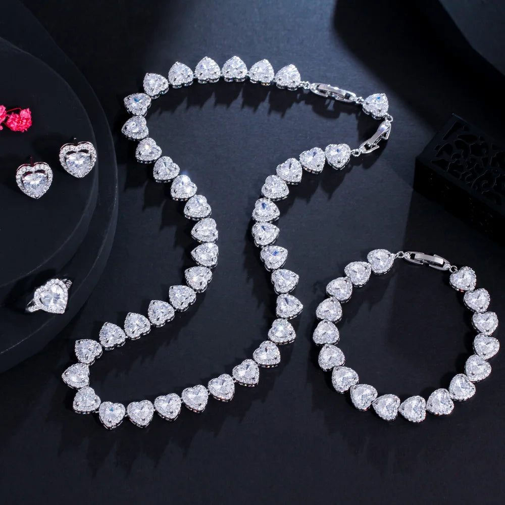 Clear heart cubic zirconia bridal jewelry set: necklace, bracelet, and heart stud earrings