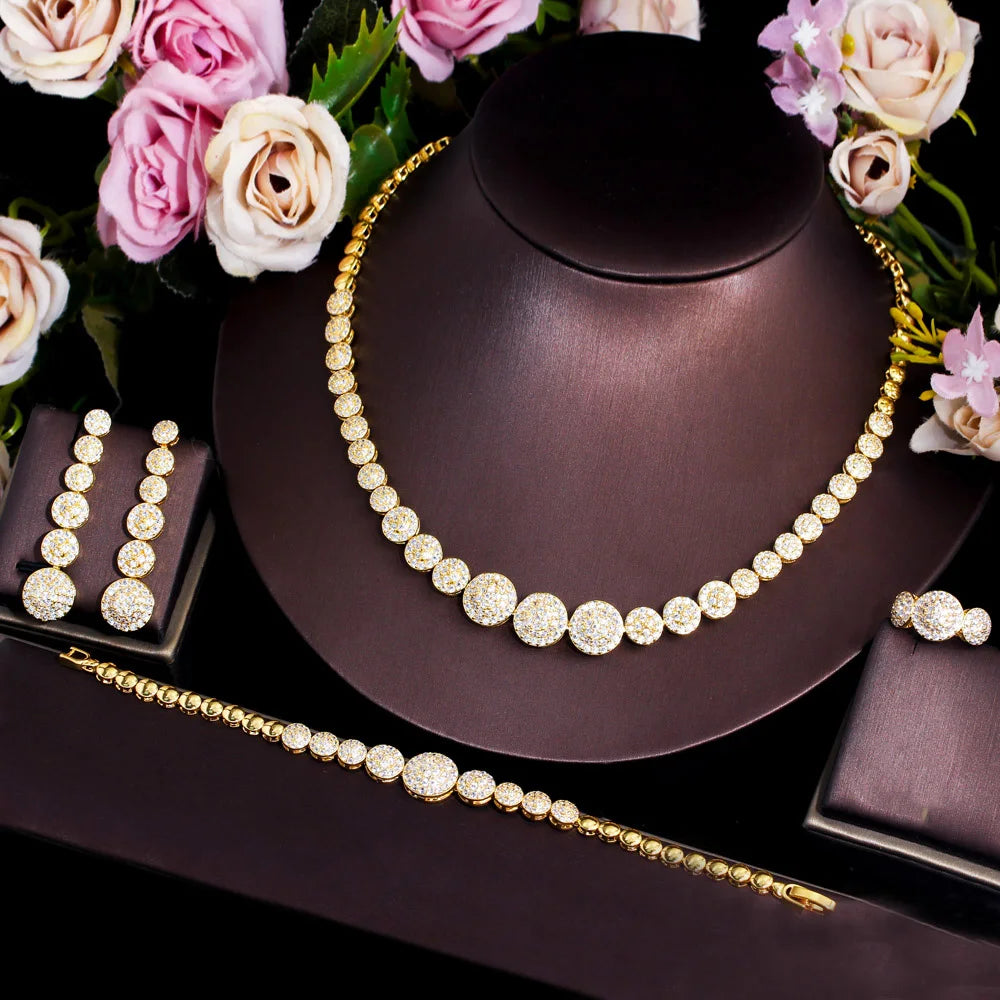 Gold-tone graduated CZ necklace with matching drop earrings and bracelet