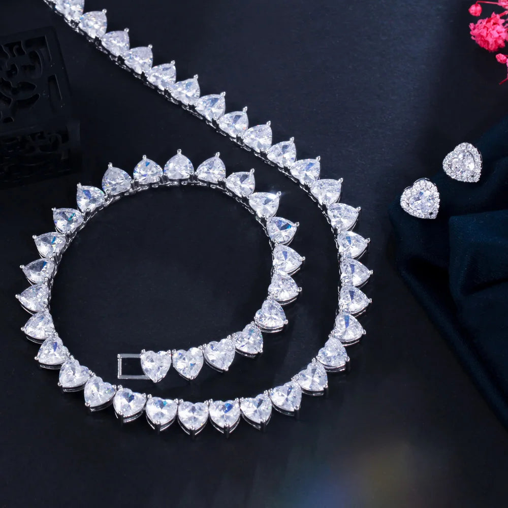 Cubic zirconia heart choker necklace set with heart stud earrings, silver-tone finish.