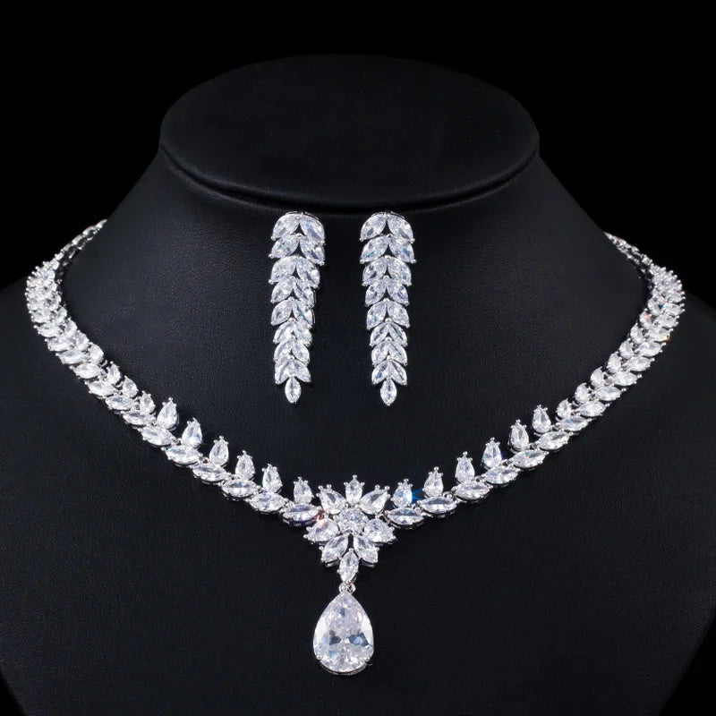 Silver-toned bridal necklace with teardrop pendant and matching drop CZ earrings