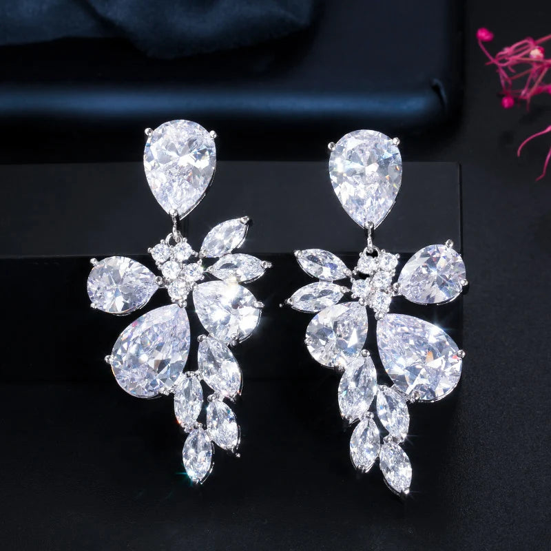 Matching crystal drop earrings with floral clusters and leaf-shaped stones