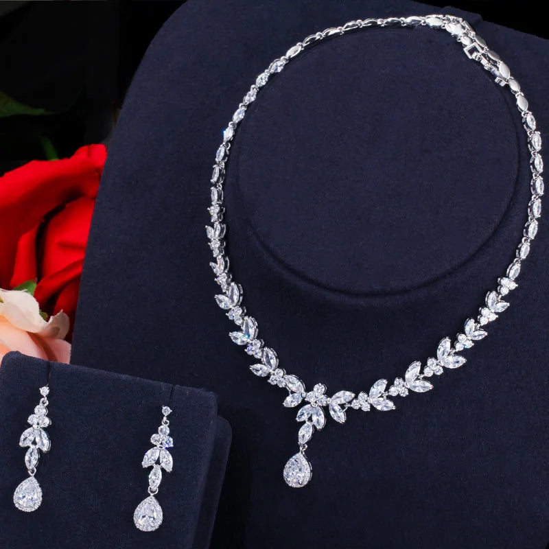 Silver-tone cubic zirconia necklace set with leaf details and matching drop earrings