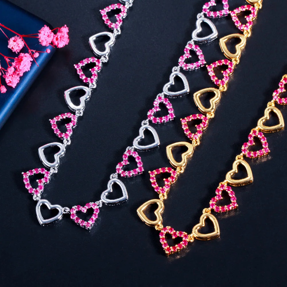 Pink jeweled heart-link necklaces in silver-tone and gold-tone finishes