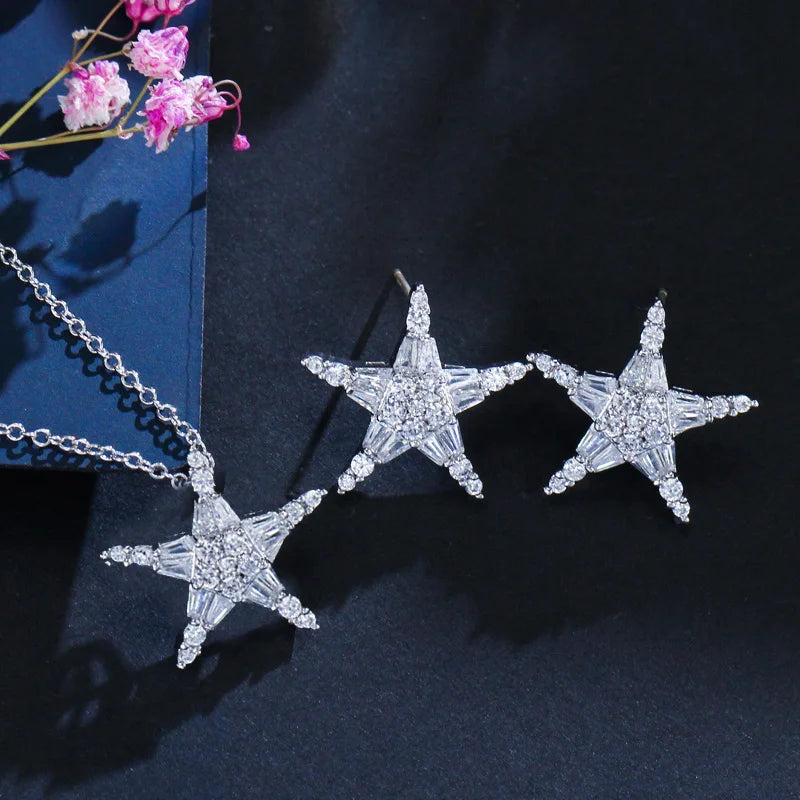Star-shaped cubic zirconia earrings with matching necklace