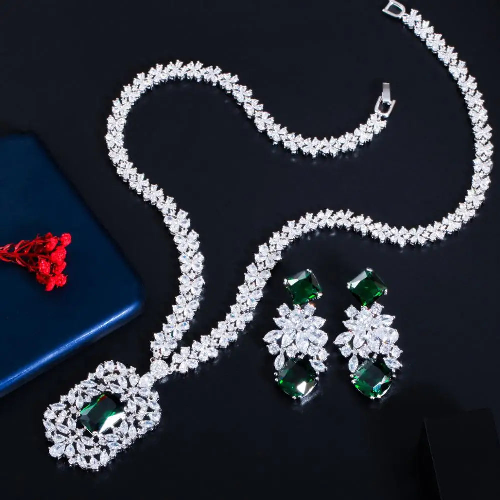 Cubic zirconia necklace set with green gemstone accents and matching drop earrings