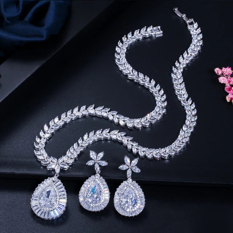Clear teardrop zircon necklace and matching flower-stud earrings