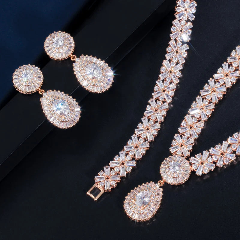 Rose gold-tone cubic zirconia jewelry set with teardrop earrings and tennis-style necklace