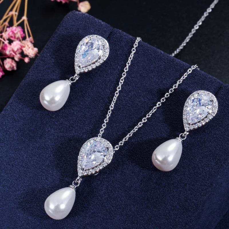 Heart CZ necklace and earrings set with white teardrop pearl drops on silver-tone chains