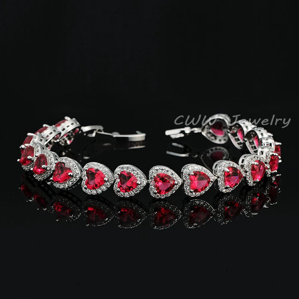 Silver-tone bracelet with red heart crystals in halo settings