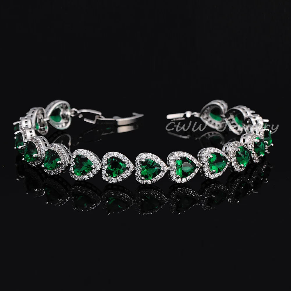 Silver-tone bracelet with green heart crystals in halo settings