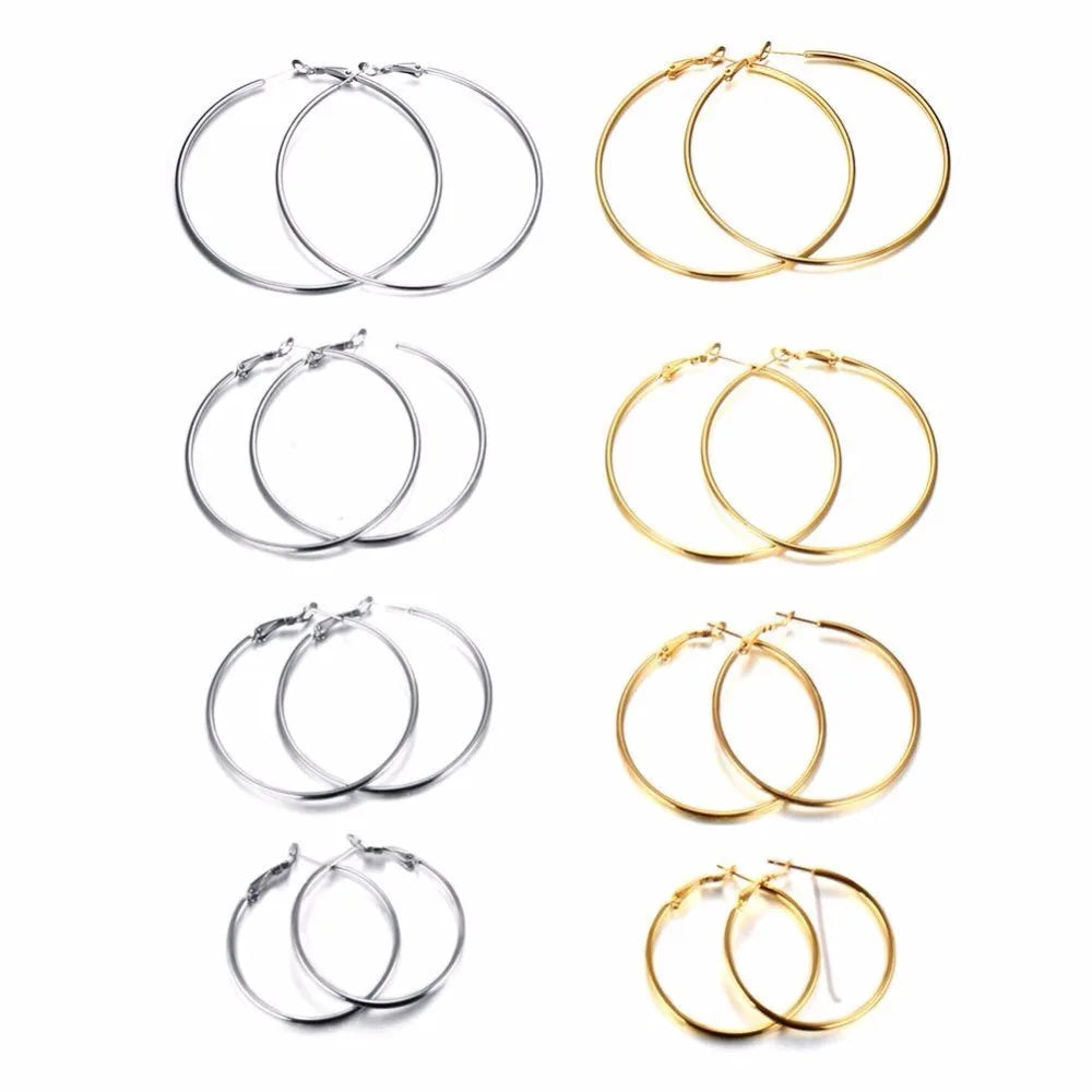 Stainless steel hoop earrings in silver and gold tones, shown in four sizes.