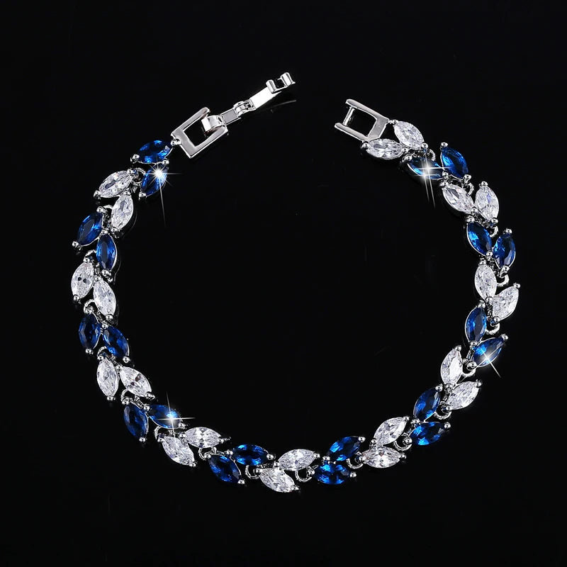 Silver-tone bracelet with alternating blue and clear marquise-cut stones