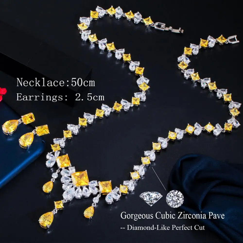 Necklace and teardrop earrings with alternating yellow and clear cubic zirconia stones