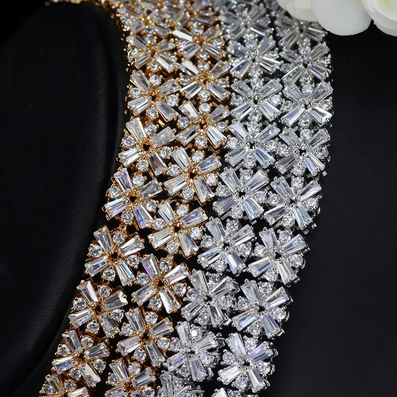 Gold- and silver-tone cubic zirconia bangle bracelet with overlapping rectangular stone rows