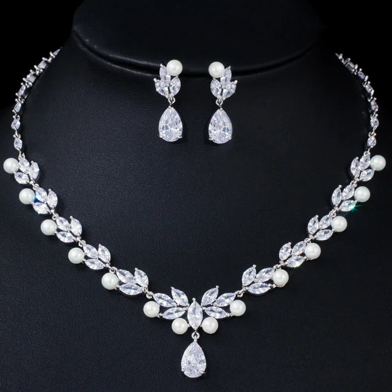 Cubic zirconia leaf drop necklace with pearl bead accents and matching dangling earrings