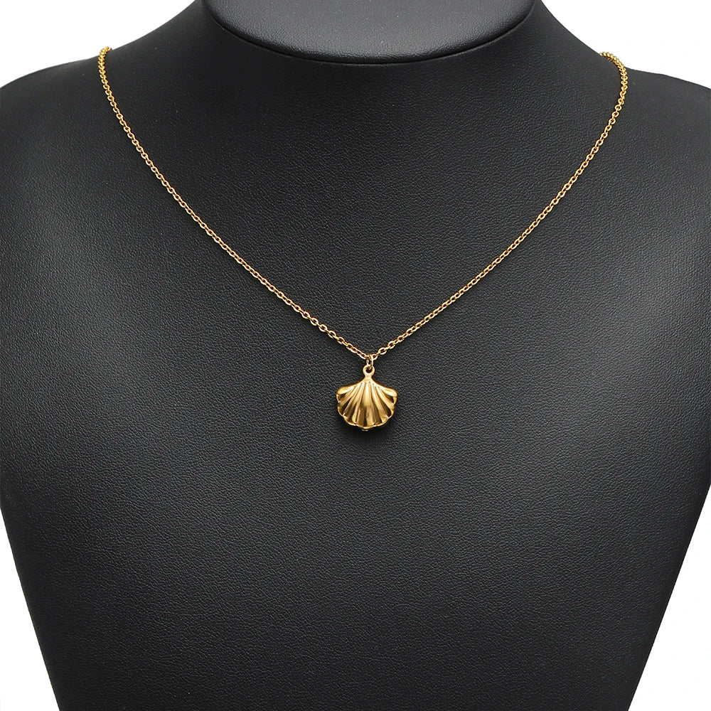 Gold-tone seashell pendant necklace with single conch shell charm on chain
