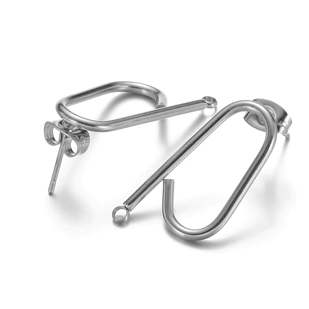 Silver long stick ear wire hooks connectors, angled close-up of two pairs
