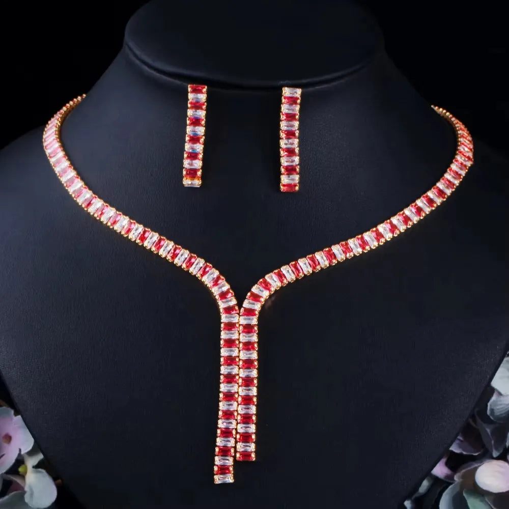 Red baguette zircon necklace with a V-shaped drop and matching bar earrings