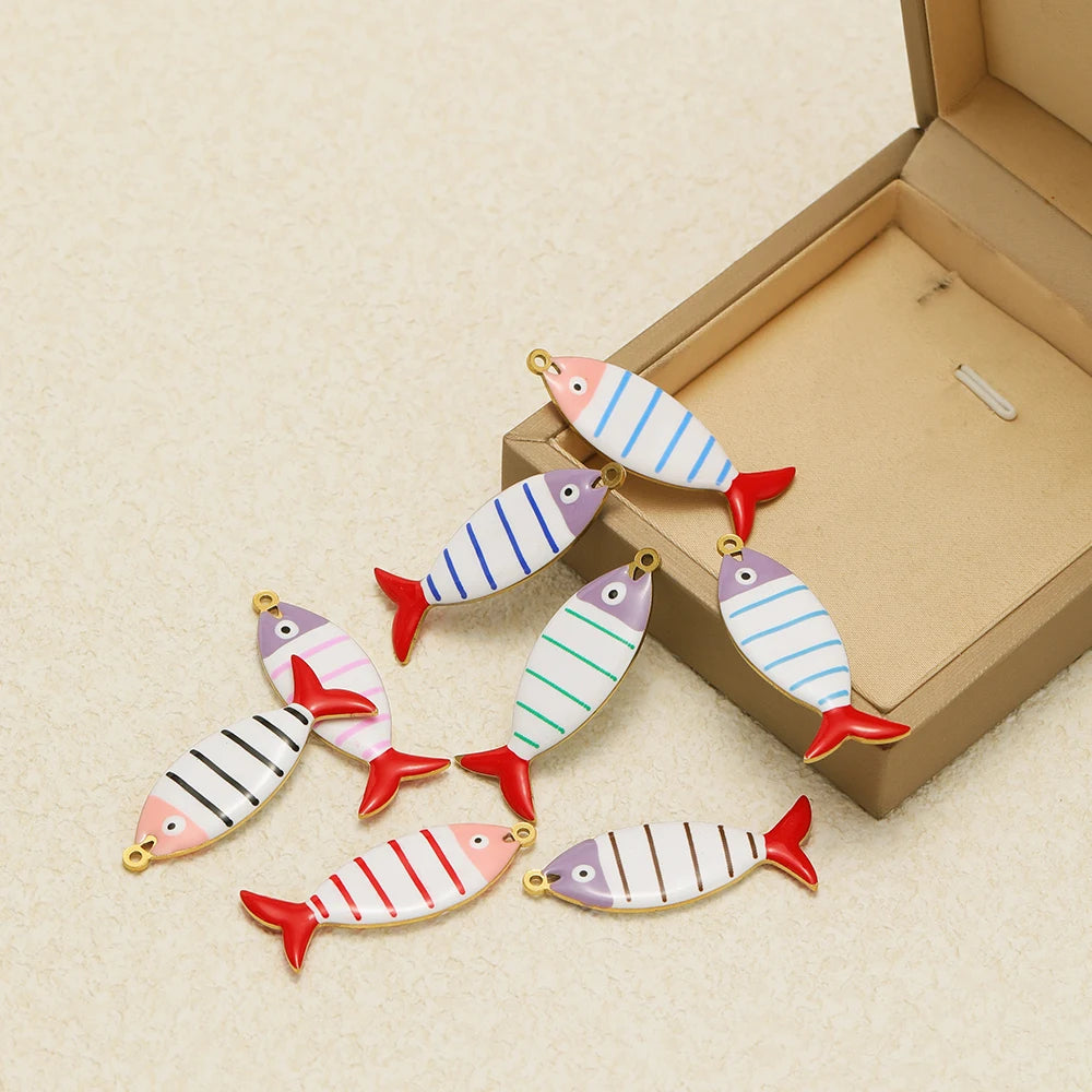 Assorted enamel striped fish pendants with gold loops, mixed stripe colors