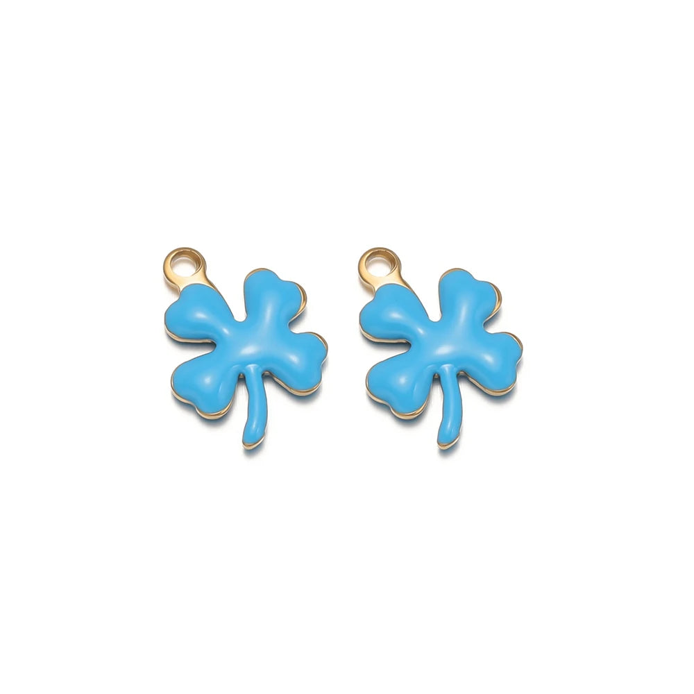 Light blue enamel clover flower charms with gold-tone loops, pair view
