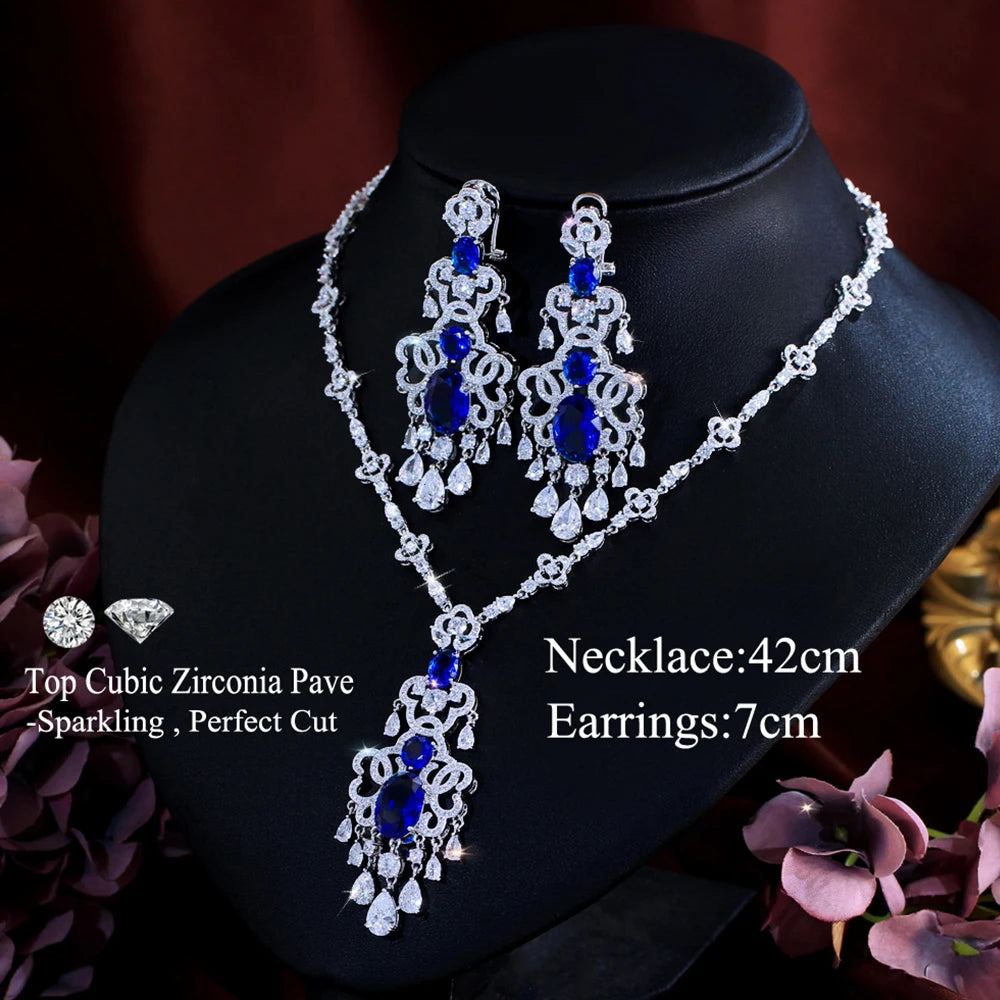 Silver-tone necklace with royal blue central pendant and matching dangling earrings