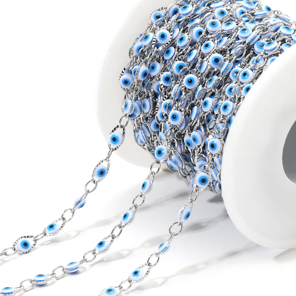 Silver-tone evil eye bead chain strand with blue oval eye beads and round link loops