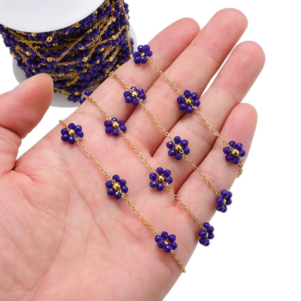 Gold-tone stainless steel daisy flower beaded satellite chain with dark blue beads