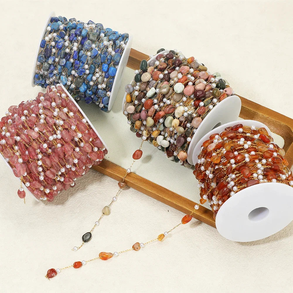 Irregular stone bead chain on gold-toned links with pearl accents, blue brown pink orange mix