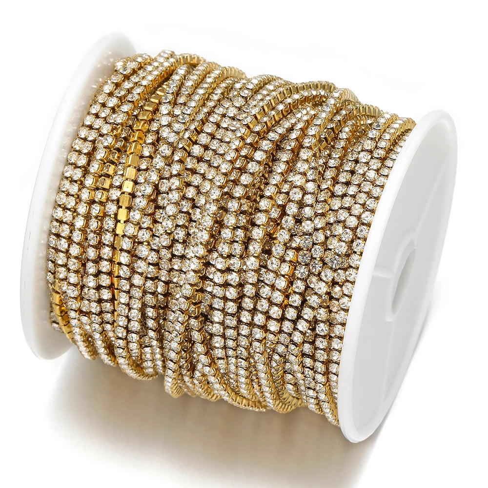 Gold plated cubic zircon chain roll on white spool, multiple tight coils