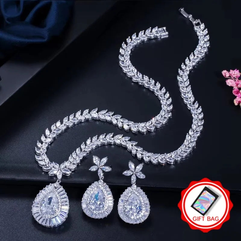 Clear teardrop zircon necklace and matching earrings, with gift bag icon