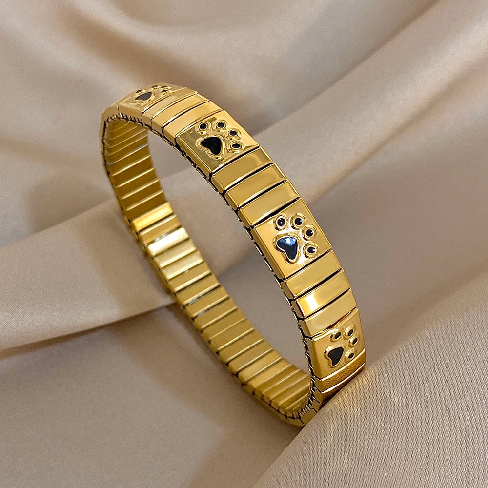 Gold enamel paw print link bracelet bangle, square paw charms on metal segments.