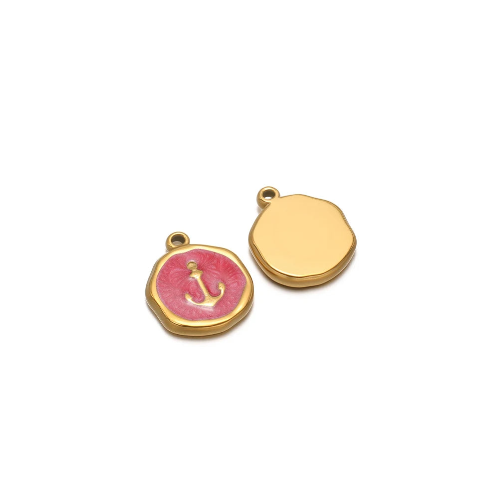 Round enamel charm pendant with gold border, pink anchor design and plain gold charm