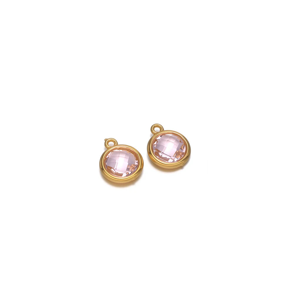 Round faceted glass charm pair in pale pink with gold-tone metal loops