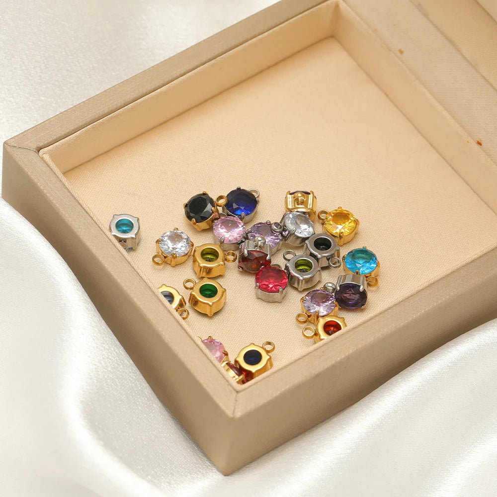 Round glass crystal sewing claws in a box, assorted stones with gold and silver settings
