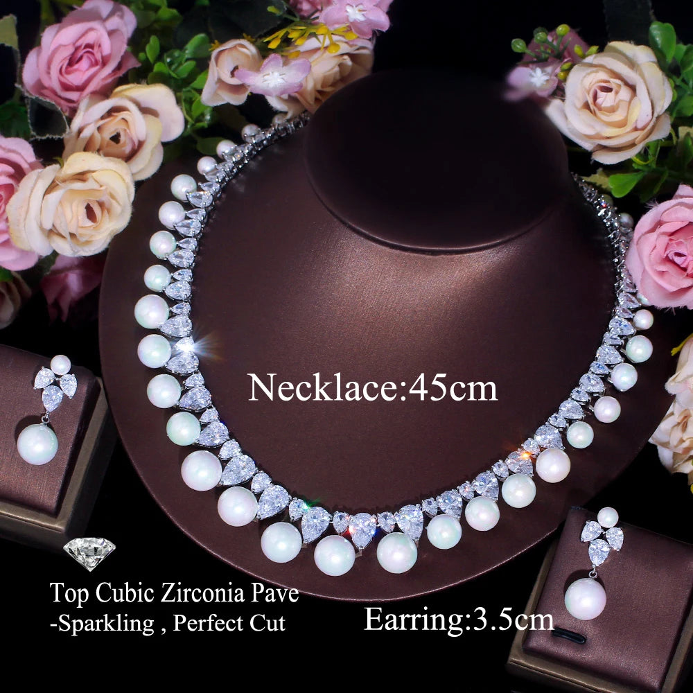 Pearl rhinestone choker necklace with drop earrings, silver-tone; rose flower background