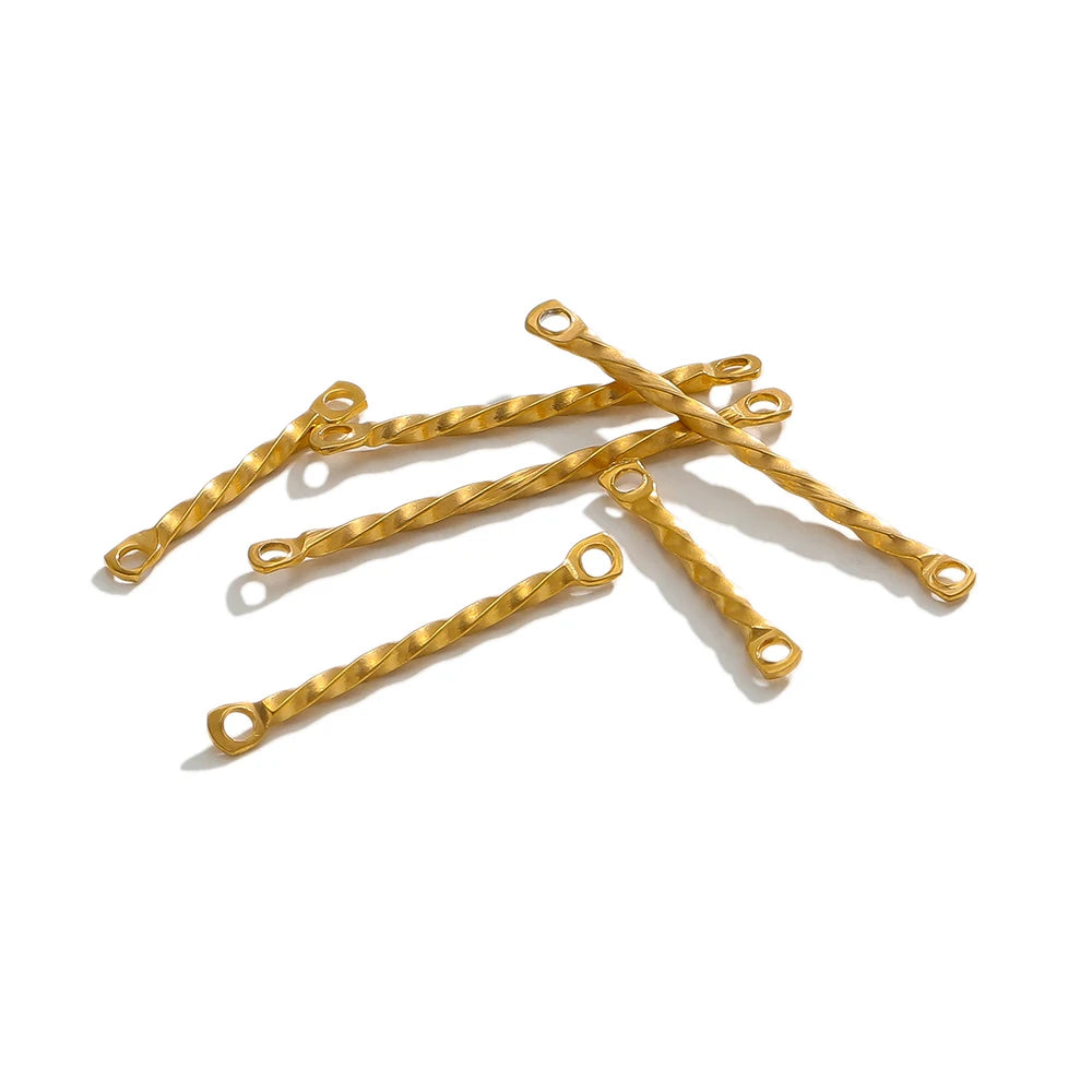 Gold twisted rod double-hole connectors, multiple pieces laid out