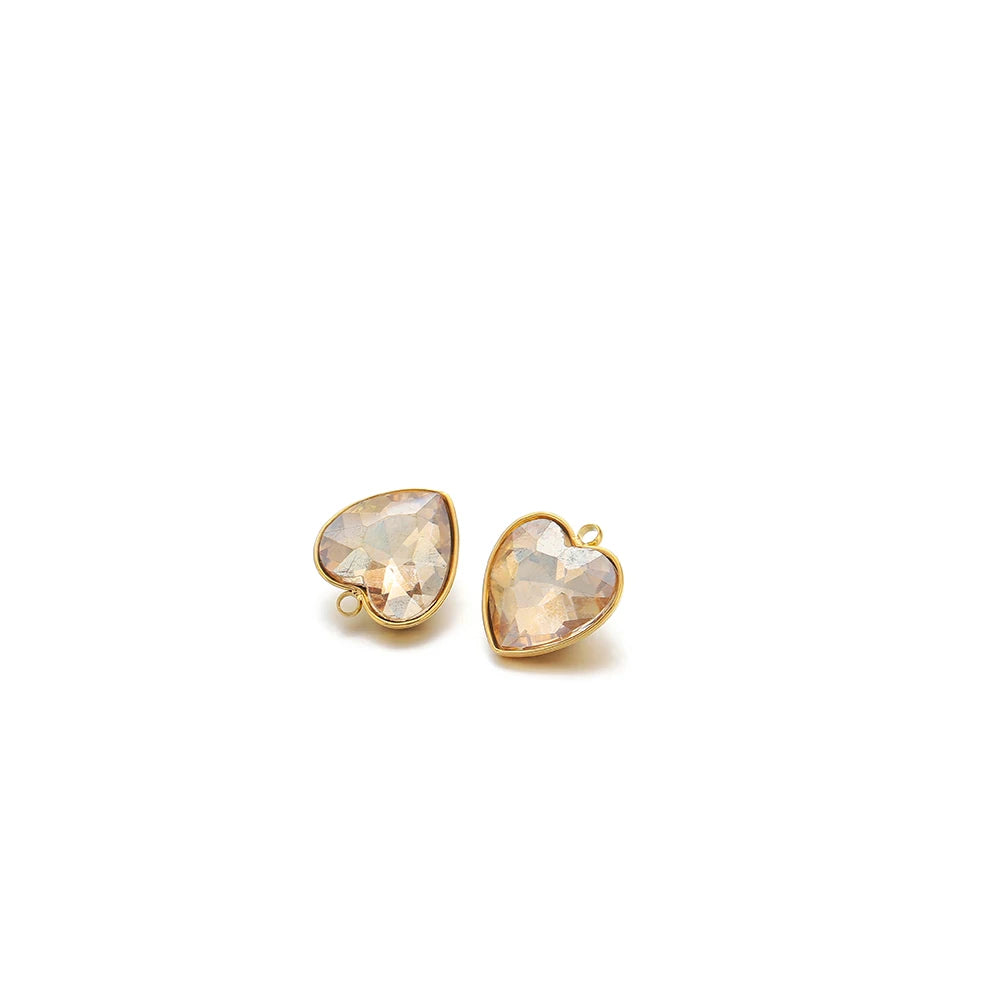 Heart-shaped crystal pendant charm, light champagne stone with gold-tone loop bail