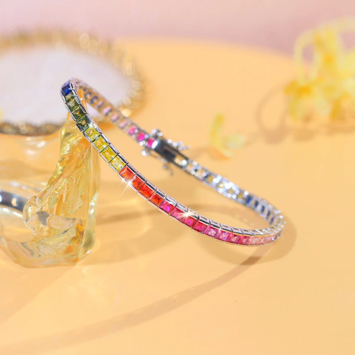 Rainbow square-cut zirconia tennis bracelet curved to show its flexible links