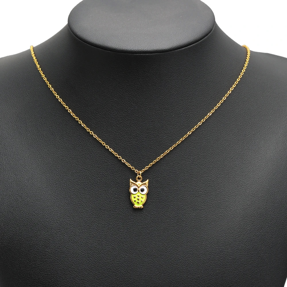 Enamel owl pendant charm on a gold chain, green belly with black eyes