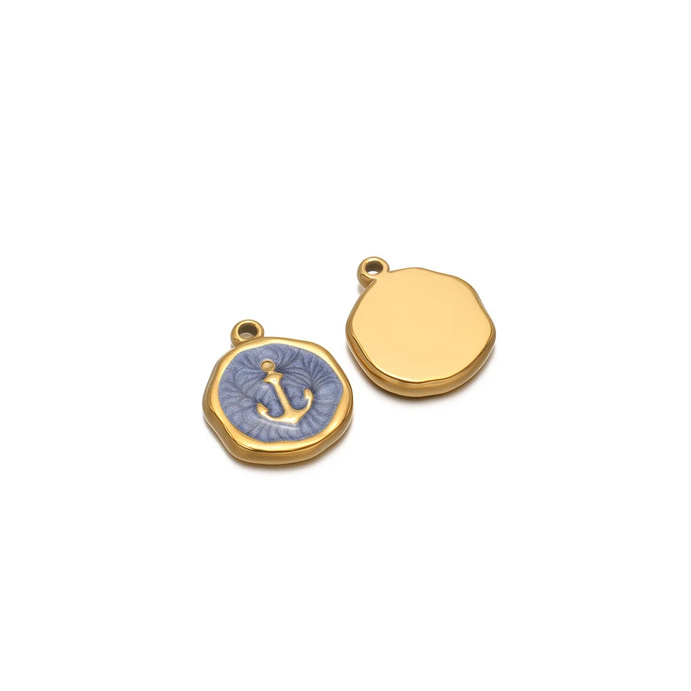 Gold-tone round charm with light blue anchor enamel, plus blank gold-tone round charm