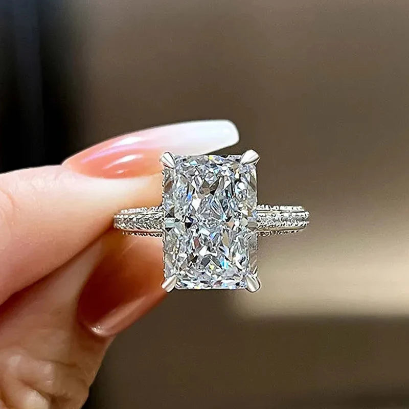 Rectangle-cut CZ ring with large clear stone and pavé band