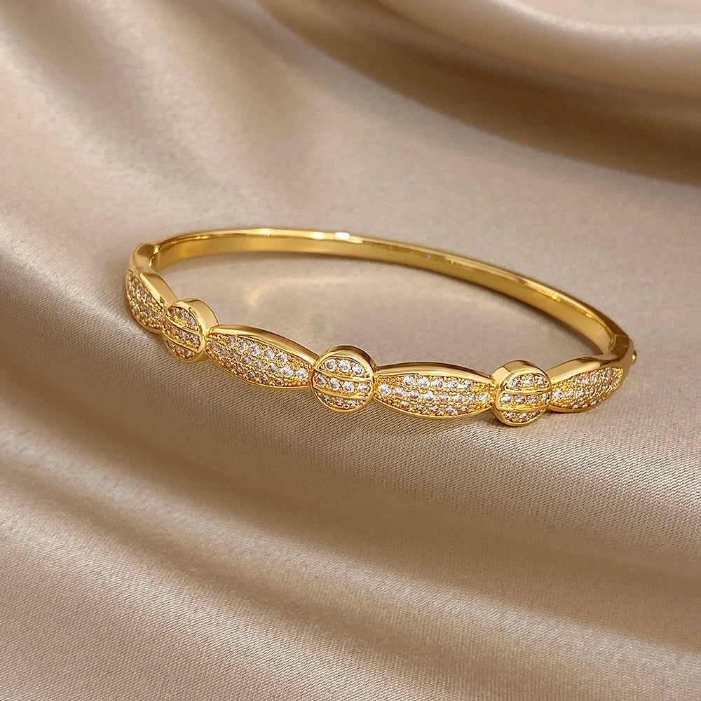 Gold-plated cuff bracelet with geometric rhinestone accents
