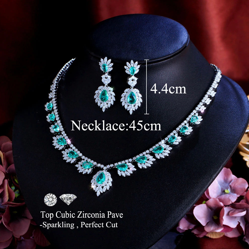 Cubic zirconia style teal necklace and drop earrings set on display stand