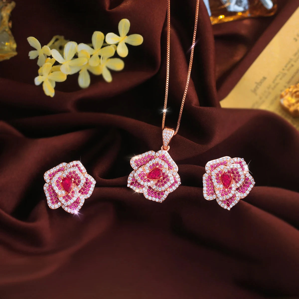 Rose-red flower pendant necklace and matching CZ earrings with layered stone details