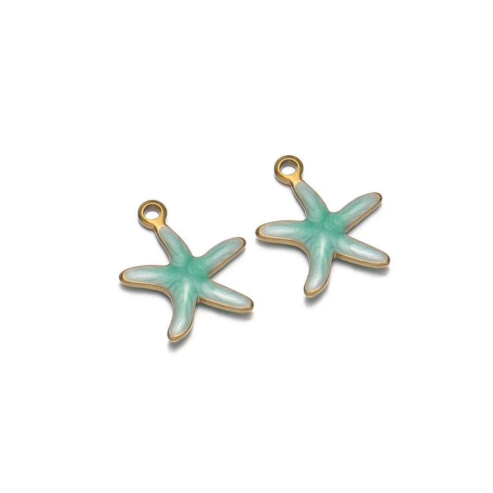 Pair of mint green starfish pendant charms with gold-tone loop openings