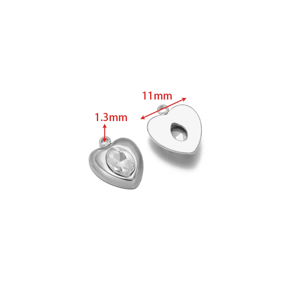Silver heart-shaped rhinestone pendant charm with clear gem and round backing